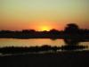 Sonnenuntergang: Sonnenuntergang über dem Wasserloch von Namutoni